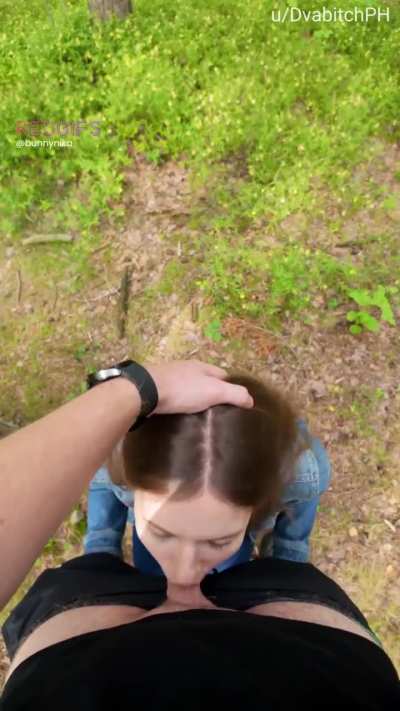 In the woods pushing my head deeper till I gag on his cock