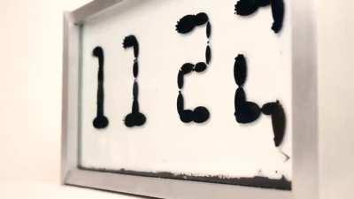Ferrolic: a Ferrofluid Clock by Zelf Koelman