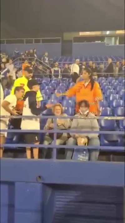 Old woman makes child cry by stealing his MVP jersey after soccer match.