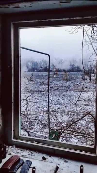 Ukrainian soldier records a 30mm autocannon pounding Russian positions in Bakhmut from a window of a ruined house