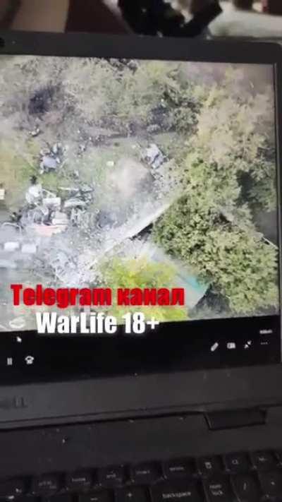 A Russian soldier is directly impacted by a drone-dropped explosive (seemingly an act of mercy).