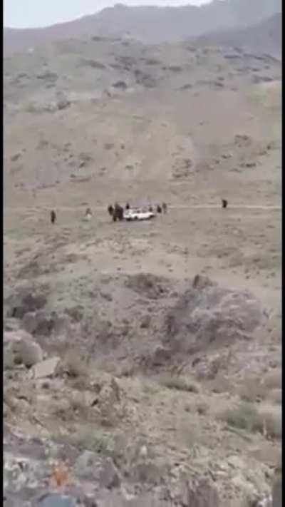 (unknown origin) presumably a group of middle eastern soldiers checking out an unassuming carbomb