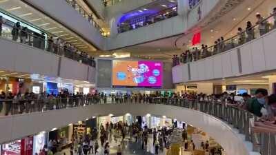 Silent white paper protest at APM mall in Kwun Tong, Hong Kong, yesterday. Police later arrested 13 people.