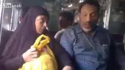 Man beating his wife in public.