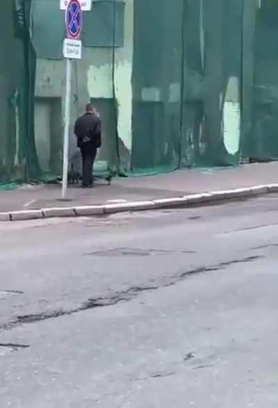 A man, a cat and a crow