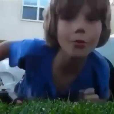 kid offers up camera to be shot, then screams when it gets shot