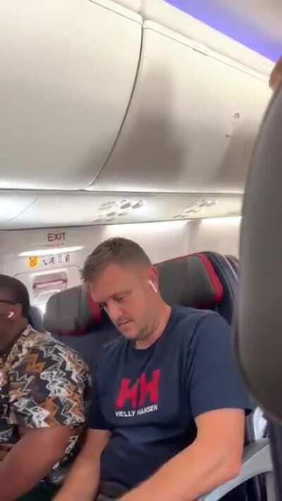 Airplane freakout, woman uses a laptop as a weapon