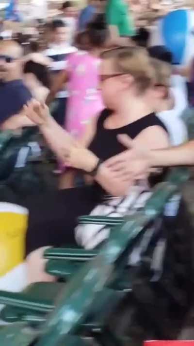Miserable Woman Destroys Beach Ball that landed near her at a kids Concert