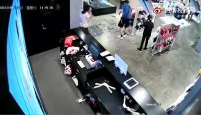 A kid hit the mirror with a basketball result in getting himself smashed by the mirror