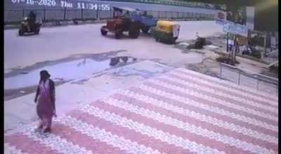 Casually walking woman gets smacked by a flying dude.