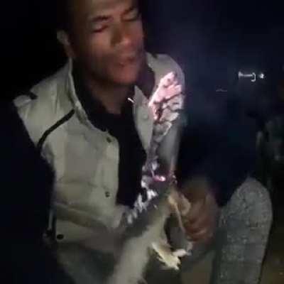 This man literally eating a lighted torch, funny yet weird in my opinion