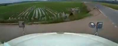 Trucker swerves and crashes to avoid meandering bicyclist on road