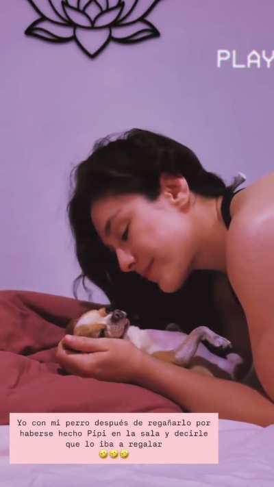 Showing love to her dog