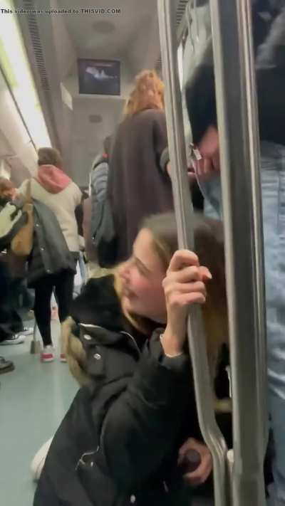 Girl give a blowjob in crowded