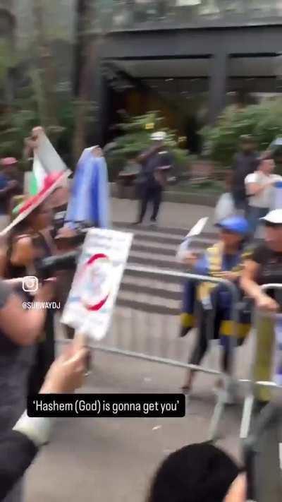 Pro-Zionist protestor shouts profanities at Hasidic child waving a Palistinian flag, calls his mother a whore.