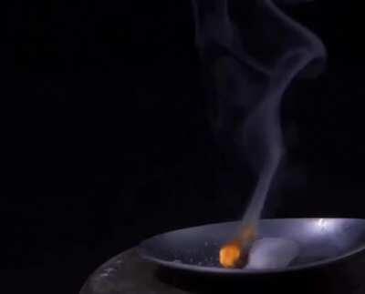 Sodium azide (NaN3) is a super reactive, inorganic compound that decomposes, when ignited, forming its elemental components. 2NaN3 -> 2Na + 3N2 In the video, the sodium metal formed, reacts further with oxygen to create sodium peroxide.