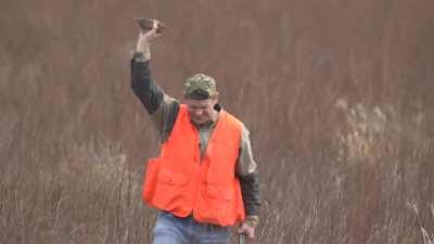 Man catches flying bird with bare hand