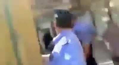 Hamas' police force tries to arrest a man in his home in Khan Younis, Gaza, over a financial dispute. He then pours gasoline on his daughters to force them out.