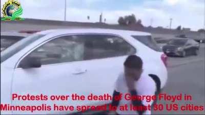 Batman & Joker with protesters