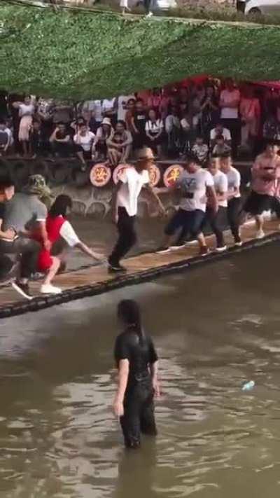 The man in the middle is perfectly balanced