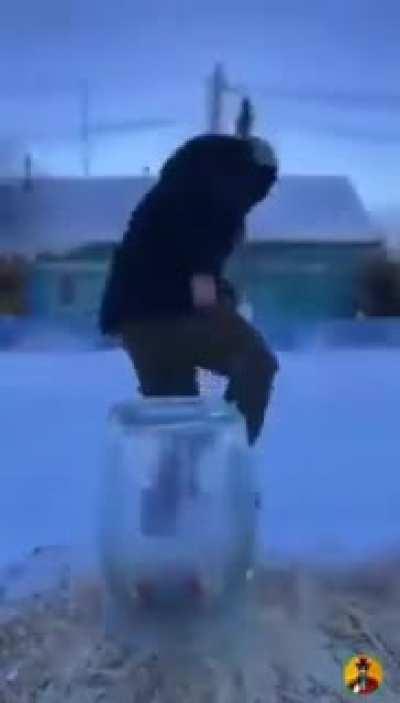 Lighting a firecracker in a glass jar.