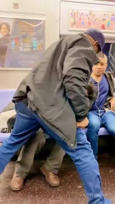 Guy pulls out scissors on train. Gets KO'd.