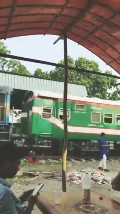 taking selfie front of upcoming train.