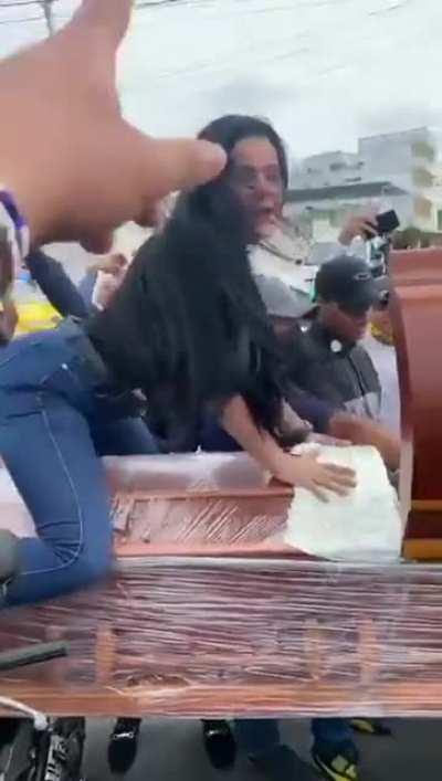 Woman twerks on boyfriend's casket