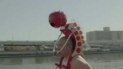 Tomatan, a wearable robot that feeds you tomatoes as you run.