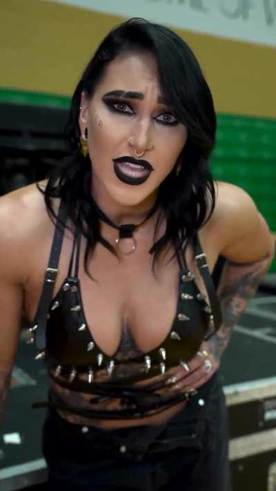 Rhea, in this outfit, with a a 13 inch spiked strapon between her legs.