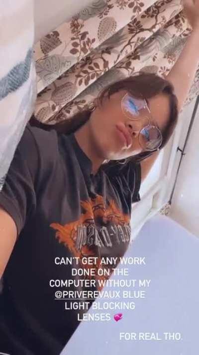 She's looking extra cute with glasses