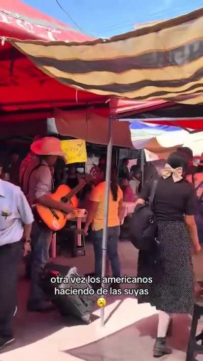 US tourist gets mad and attempts to fight street musician, other locals step in to defend musician and tell the tourists “this is Mexico, you don’t make the rules here”. Tepic, Mexico