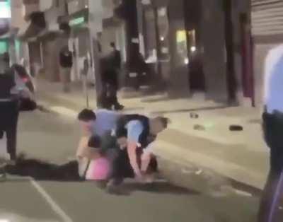 The cop literally put that man's hand on the stick just so he could have a reason to beat him up