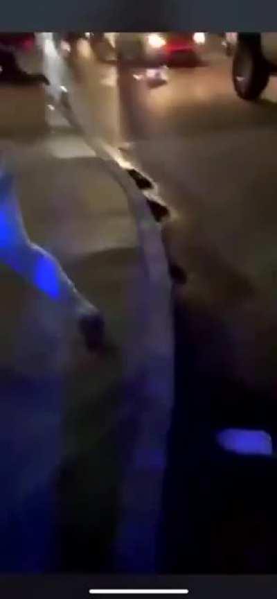 Cop gets jumped by protesters and runs away