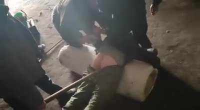 A video demonstrates how Russian servicemen intimidate their fellow soldiers who refuse to participate in the suicide assault mission.