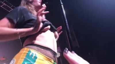 Tove Lo flashing during a concert