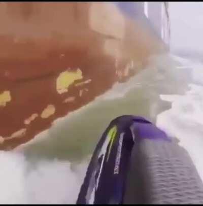 Good morning, here is a jetskiier being partially sucked under a cargo ship