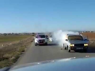 Lighting fireworks from a moving car.