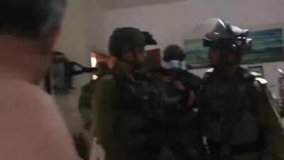 IDF soldiers pepper spray an old lady's room and leaving after arresting her grandchild.