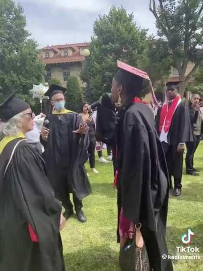 Graduate steals the mic and causes a scene