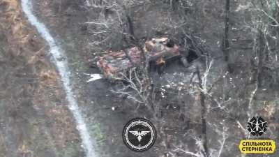 russians attempt to hide inside a destroyed BTR