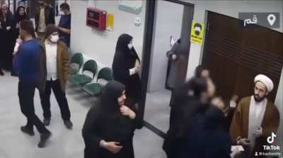 Iranian mullah is caught taking photos of women in office