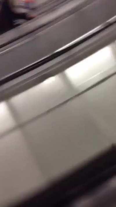 Sliding down the escalator while drunk