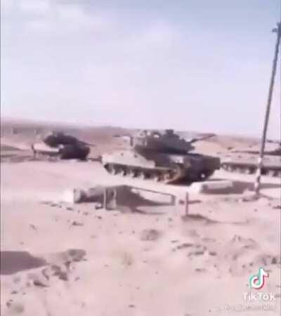 SpongeVlad passing by some army tanks