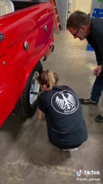 Working on her car