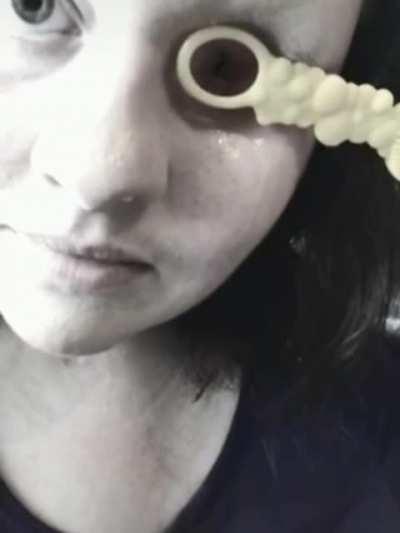 Girl blowing bubbles with eye socket!