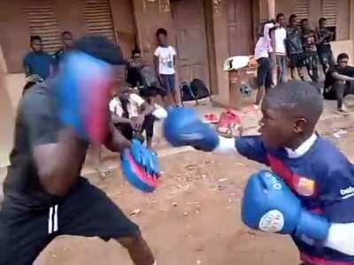 Meet 10-year old boxing sensation Sultan Adekoya with his trainer, Coach Tito. Served from Lagos, Nigeria. Sultan has won some great fights.