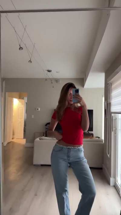 In red top and jeans | IG January 2025