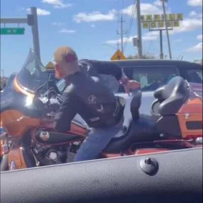 Biker is vibing out at the red light