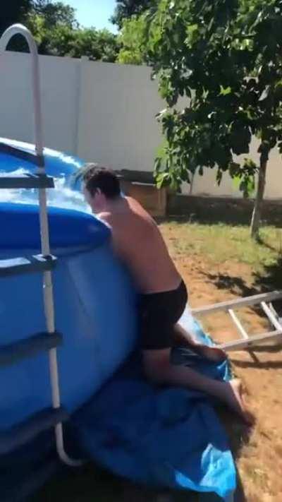 At using a ladder to jump into a pool.